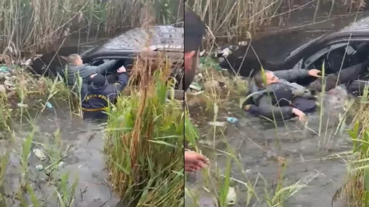 Bakıda polis bataqlığa düşən sürücünü belə xilas etdi - VİDEO