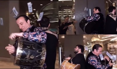 Başına dollar səpdirib VİDEO çəkdi